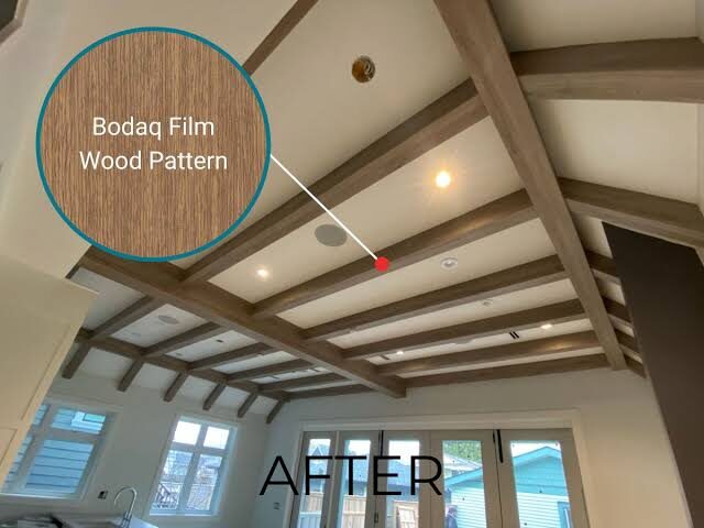 Exposed beam ceiling wrapped in Bodaq wood-grain film