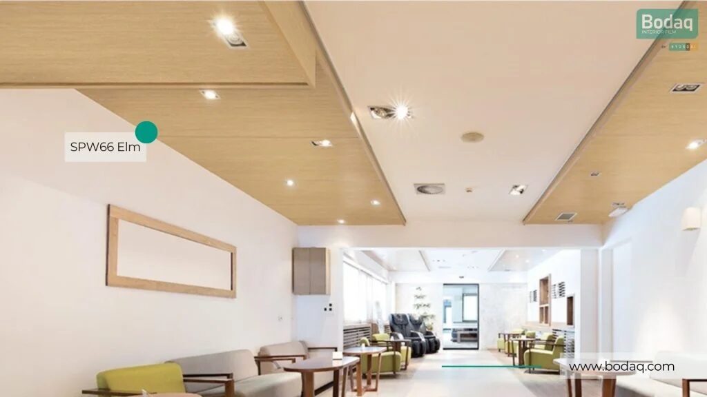 Hospitality lobby ceiling wrapped in Bodaq SPW66 Elm film