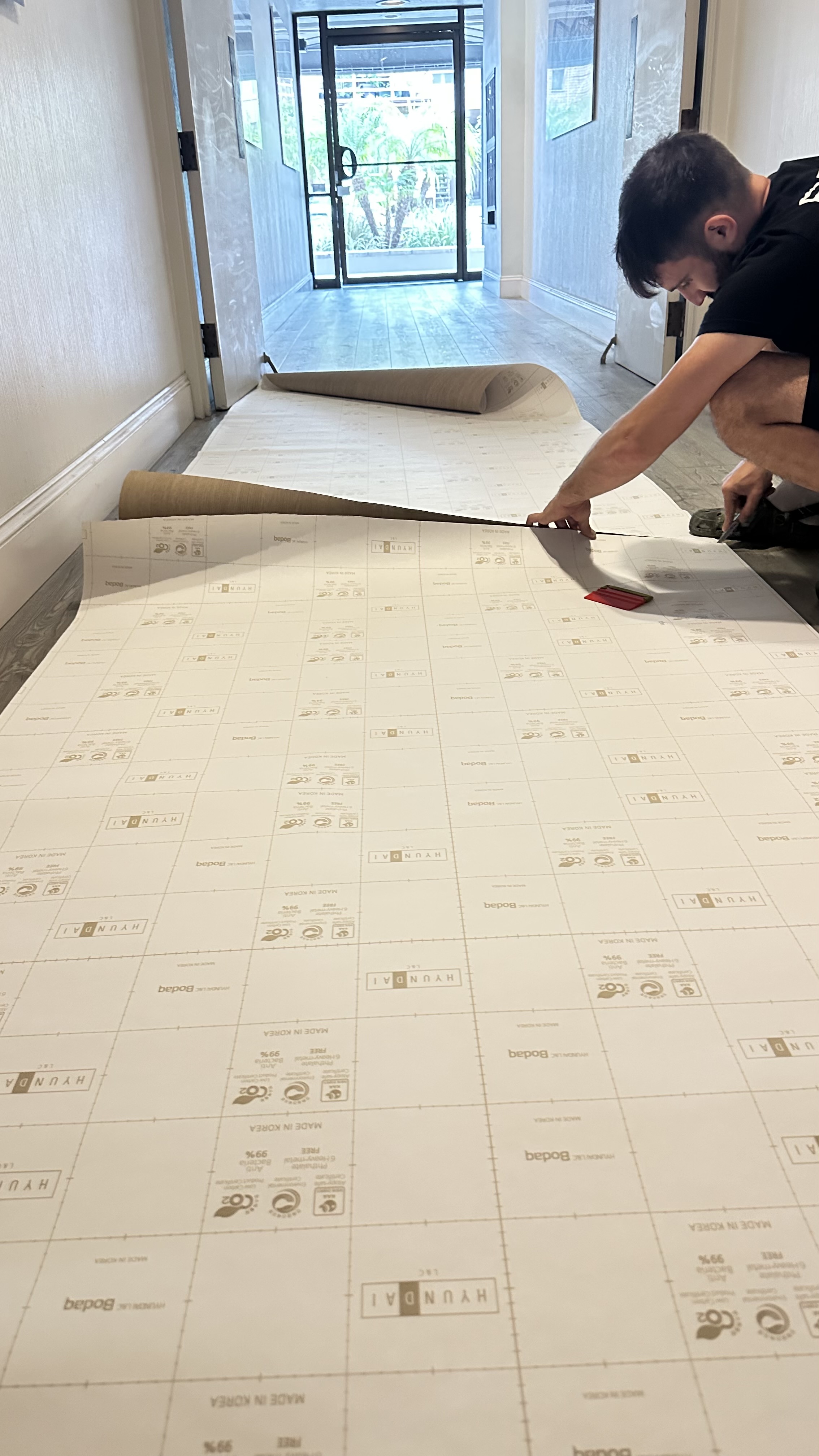 Installer preparing door film on site