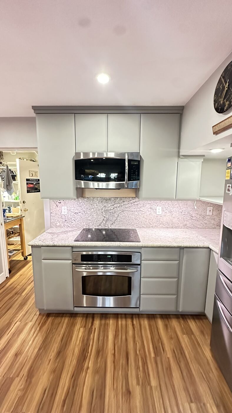 Finished kitchen cabinets wrapped in Bodaq S209 light sage film