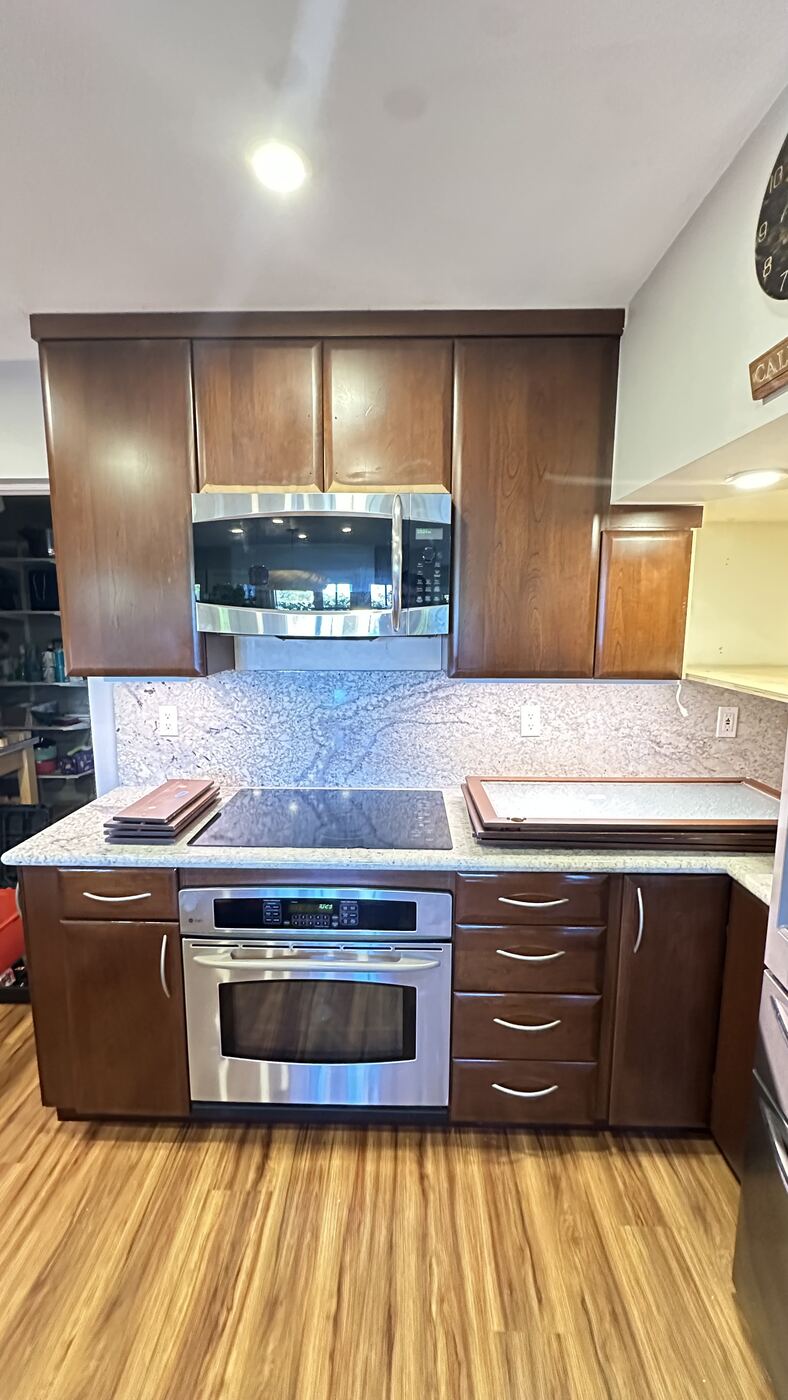 Old dark wood kitchen cabinets before Bodaq S209 film wrap